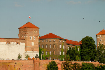 Horizontal architectural photo of Wawel castle walls and red-roofed towers real life photography © Artem