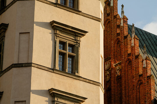 Horizontal architectural contrast photo of Wawel facade and red brick detail real life photography