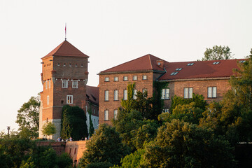 Horizontal golden-hour architectural photo of Wawel castle walls and towers real life photography © Artem