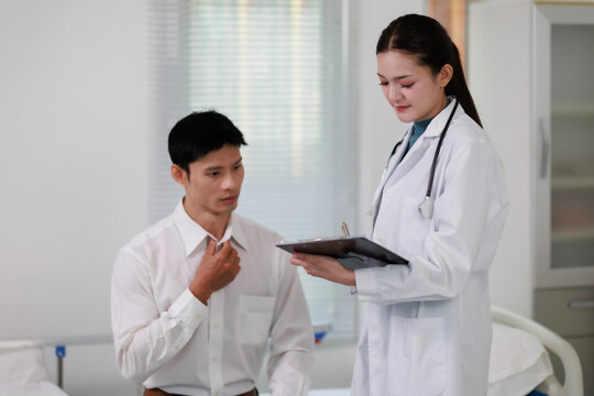 Doctor discussing medical information with a patient during a healthcare consultation, providing advice and support in a clinic examination room