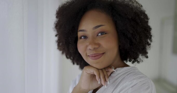 Portrait of young beautiful happy positive african american woman standing. Smile happy face fashion afro black girl looking. Lifestyle motherhood has toothy smile, dressed in casual, girl next door