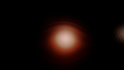 Fototapeta premium Abstract glowing red and orange lens flare spotlight on dark background for cinematic overlay