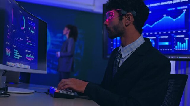 Business analyst computer dashboard data chart office technology man screen analyzing finance report statistics graph monitor keyboard digital workplace blue light interface