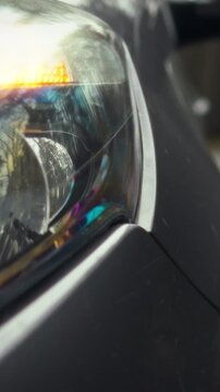 Vehicles with flashing hazard lights line the roadside, their intermittent signals warning nearby traffic of potential danger, a routine automobile safety measure within everyday transportation flow