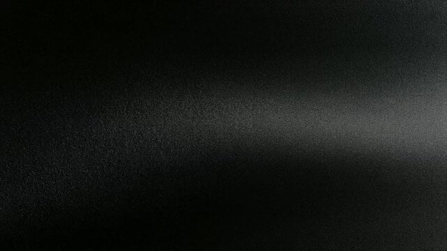 粒子がゆっくり流れるフィルムグレインの背景