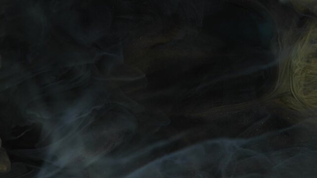Shooting paint underwater with ink spreading in clear water