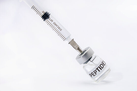 Syringe draws medical peptide liquid bottle for hopeful patient therapy modern treatment clinical health research background