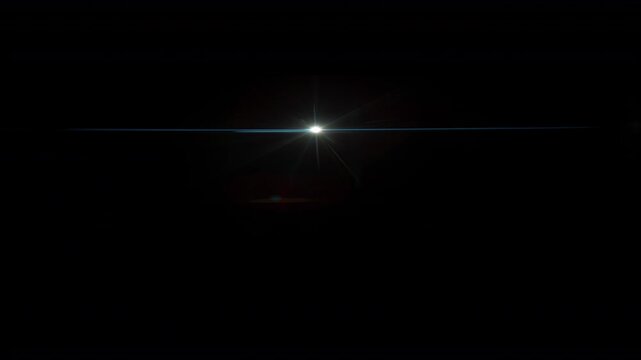Real Shooted Anamorphic Lens Flare on Black Background in Super Slow Motion.