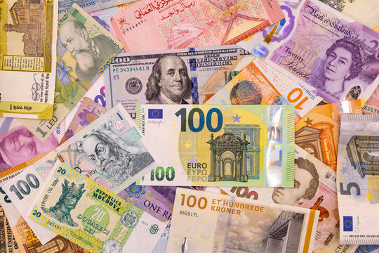 Close-up of world money banknotes pattern. Concept of international finance, travel and forex exchange.
