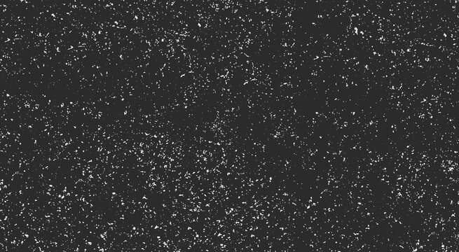 Distressed grunge texture with white speckles on a dark black background, overlay effect for vintage design elements, grainy surface pattern for retro style graphic projects