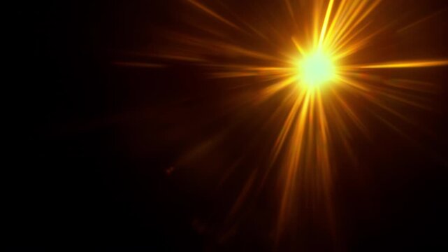 Real Shooted Orange Lens Flare Overlay in Motion Isolated on Black Background in Slow Motion.
