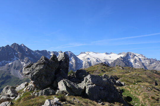 Scenic alpine landscape from Cima le Sorti peak with view of Adamello mountain range and glacier Italy