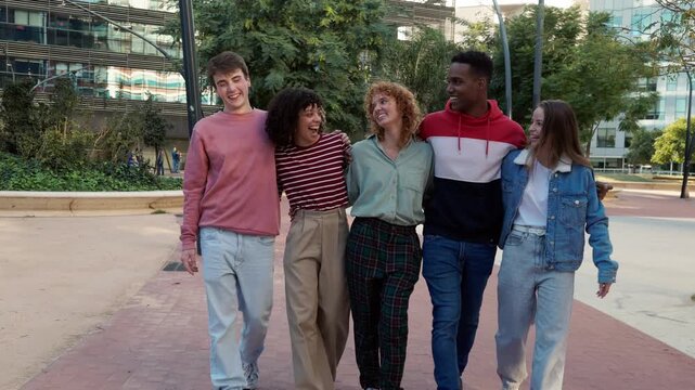 Group of happy multiethnic friends walking together