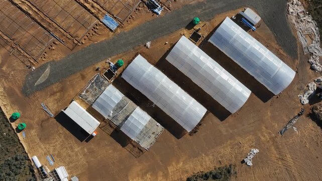 Aerial ascends over greenhouses in Little Karoo region of South Africa