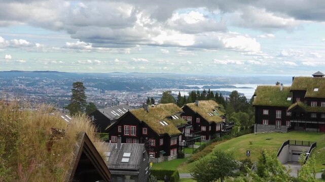Houses in the village in Norway. Traditional grass roof homes with a view towards the city of Oslo and the Oslo fjord.