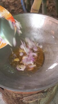 Cooking Thai sweet and sour eggs (Kai Look Khuey). Deep-frying hard-boiled eggs until golden, simmering palm sugar with tamarind, and dressing over eggs.