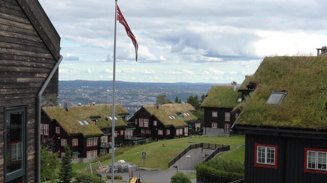 Houses in the village in Norway. Traditional grass roof homes with a view towards the city of Oslo and the Oslo fjord.