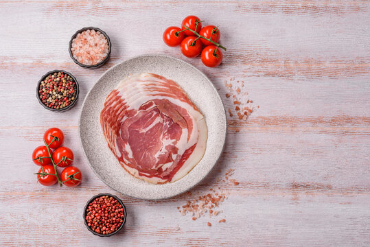 Slices of pork pancetta, ham, or bacon for a festive antipasto platter