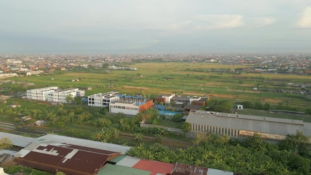 Last Remaining Rice Fields And Clear Land Near Legian Seminyak Bali Indonesia Drone Rise Morning 4K 60FPS