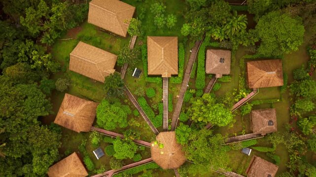 Top down aerial view of rising water flooding a jungle lodge in the ecuadorian amazon rainforest