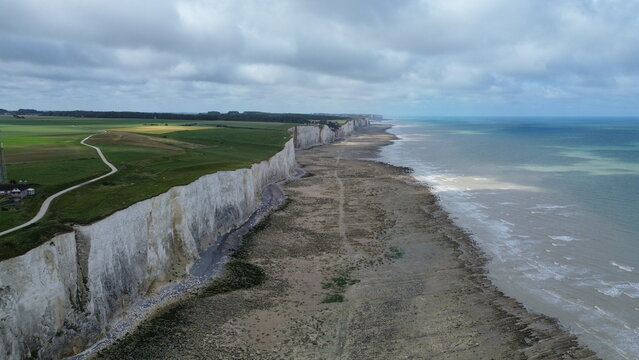 Panoramic aerial view of white chalk cliffs and Atlantic ocean coastline in Ault near Somme Bay, France