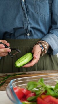 Woman Cleaning Cucumbers For A Vegetable Salad. Vertical video