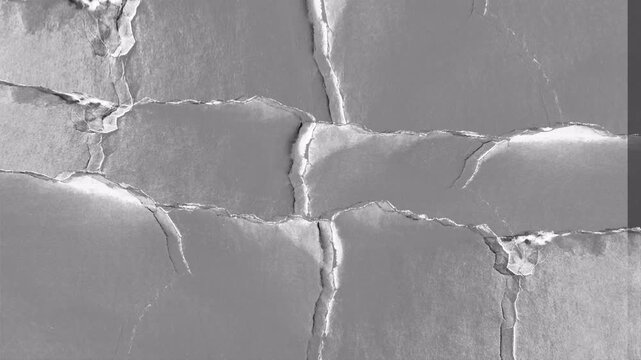 Close up microscopic view of cracked surface texture.