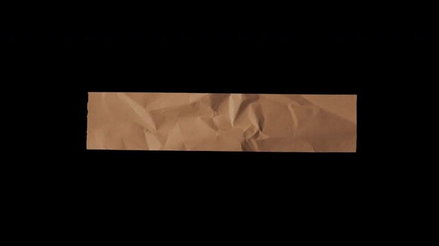 Crumpled brown paper strip isolated on black background.