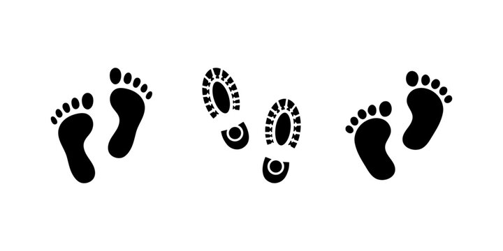Set of black silhouette footprints including bare human feet and rugged boot shoe prints on white background