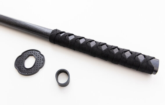 Black Wood and Cord Wrapped Sword Handle with Tsuba on White