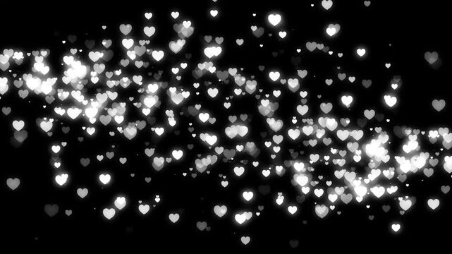 White glitter heart trail with twinkling sparkles, glowing particle dust and romantic bokeh lights, luxury wedding and valentine&rsquo;s day love overlay, dark background animation 4k