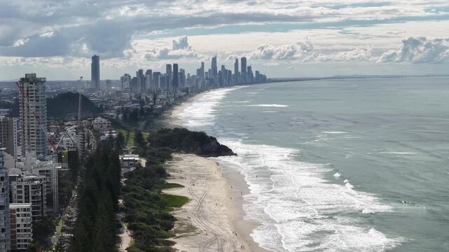 Top down aerial footage of waves breaking on the sand at Burleigh Heads, Gold Coast, Queensland Australia