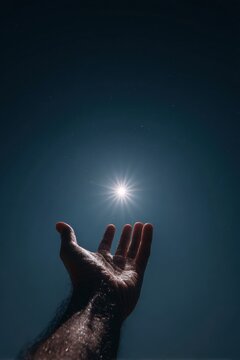 Reaching for the Light: A human hand opens to the sky, bathed in the brilliant glow of the sun, symbolizing hope and aspiration under a clear, vast expanse.