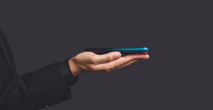 Hand Holding Smartphone Flat on Open Palm With Copy Space