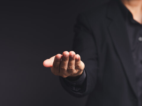 Person Holding Open Palm in Presentation Gesture