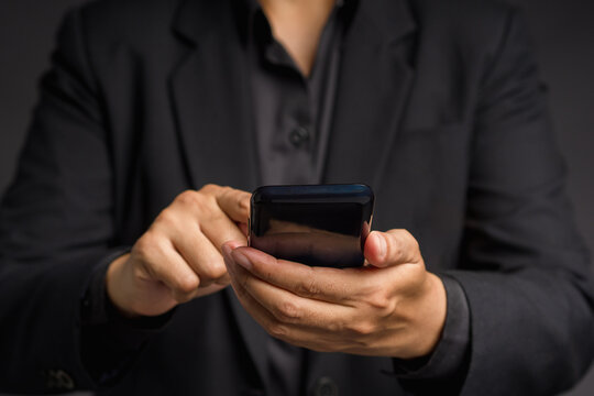 Person Tapping Smartphone Screen With Finger