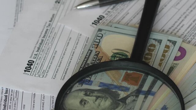 Tax Return Form 1040 documents. Official IRS paper forms prepared for detailed inspection, financial audit, and payment calculation.