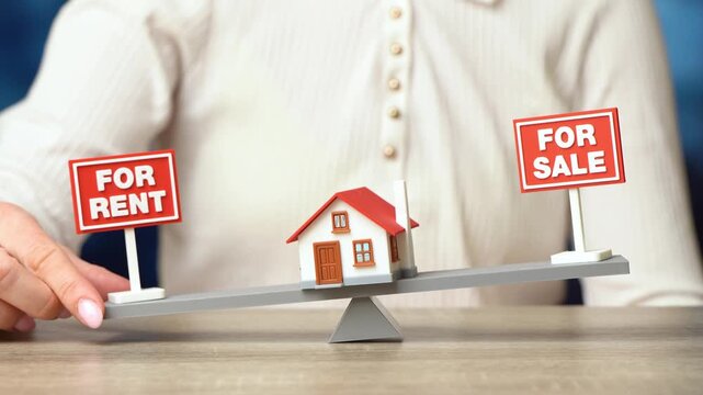 Buy or rent a house. Sell the house or rent it out for regular income. Property decision concept shows investment strategy, housing market choice, and income planning. Female hand