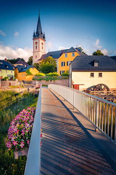 Wonderful summer view of St. Gumbertus - Evangelisch-Lutherische Kirchengemeinde church. Sunny morning cityscape of Schwarzenbach an der Saale town, Bavaria, Germany, Europe.