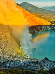 Turquoise acid lake and steaming volcanic landscape of Ijen Crater at sunrise, East Java, Indonesia © Wahde Stock