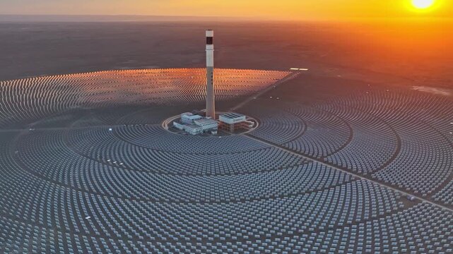 Molten salt tower solar thermal power plant at sunrise, new energy source, super mirror power plant, prism tower