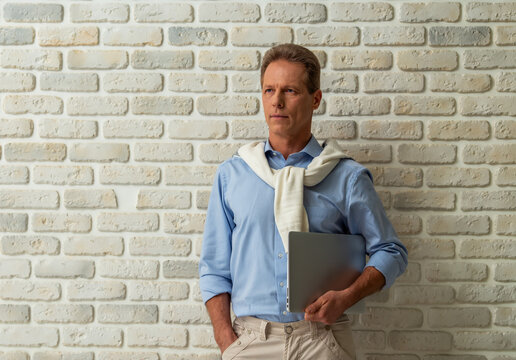 Professional Man Holding Laptop.