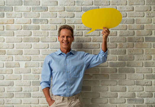 Man Holding Speech Bubble.