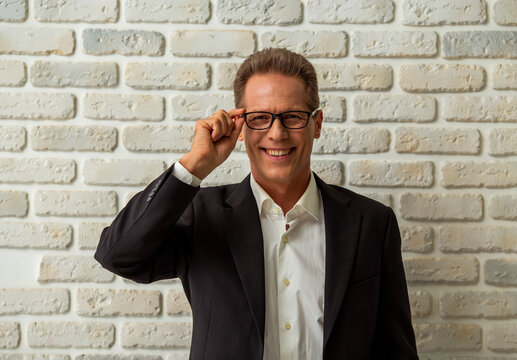 Confident Businessman Wearing Glasses.