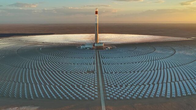 Molten salt tower solar thermal power plant at sunrise, new energy source, super mirror power plant, prism tower
