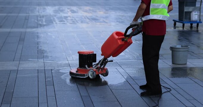 Cleaner cleaning the dirty street in Chengdu city, China