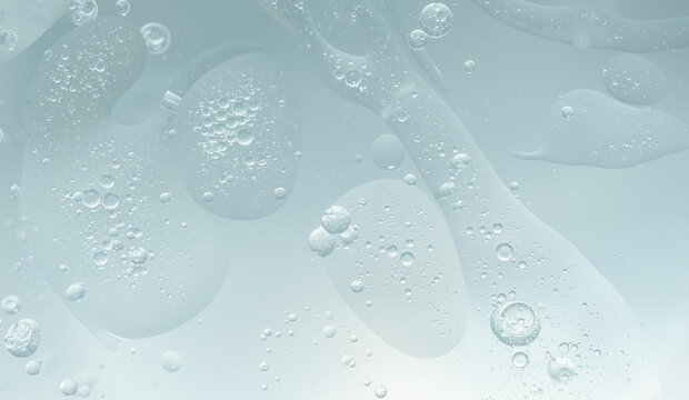 Abstract Blue water bubbles essential oil beauty collagen Serum Repair cell background.