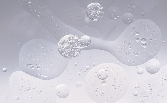 Abstract purple water bubbles essential oil beauty collagen Serum Repair cell background.