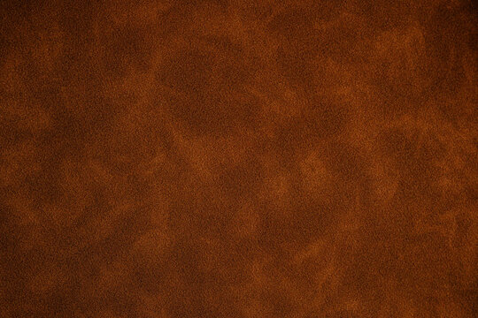 Closeup of brown suede texture for material background Close up surface of brown suede material showing fine texture for backgrounds