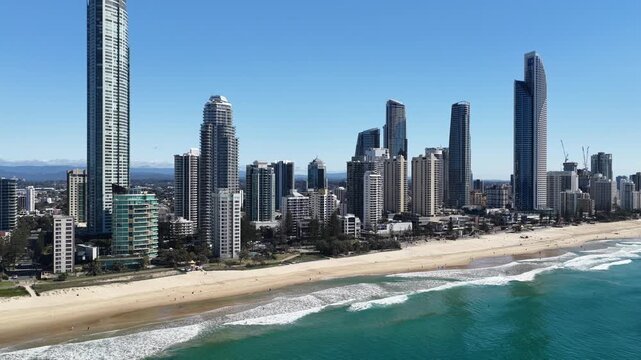 Surfers Paradise coastline from above, surf breaking beside the high-rise strip, Gold Coast, Queensland Australia